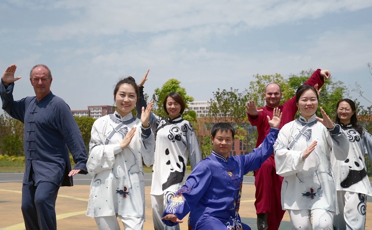 Staff and students performing Tai Chi at Chengdu University Stirling College