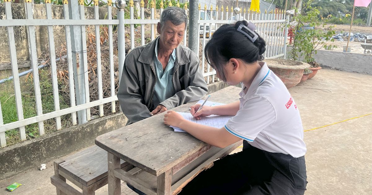 A researcher from RMIT University Vietnam interviewing a shrimp farmer about welfare end environmental practices.