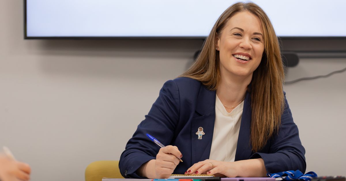 Nicky Reid CEO of the SPFL Trust smiling during a meeting