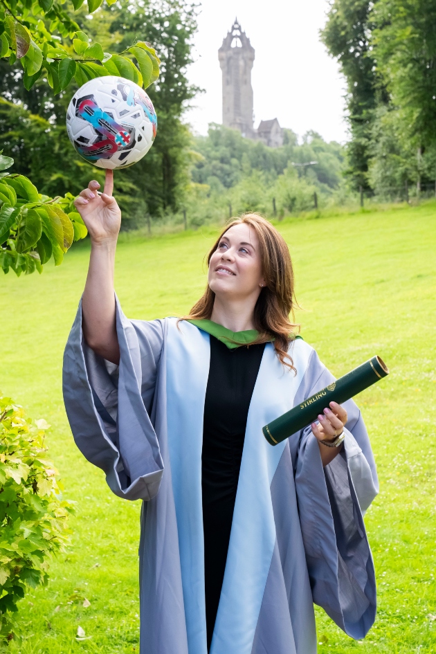 Nicky Reid received an honorary degree from the University of Stirling. Pictured in front of the Wallace Monument.