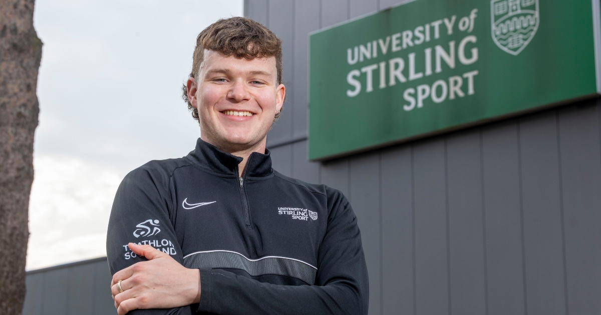 Headshot of Tom Williamson in front of the University of Stirling Sports Centre.