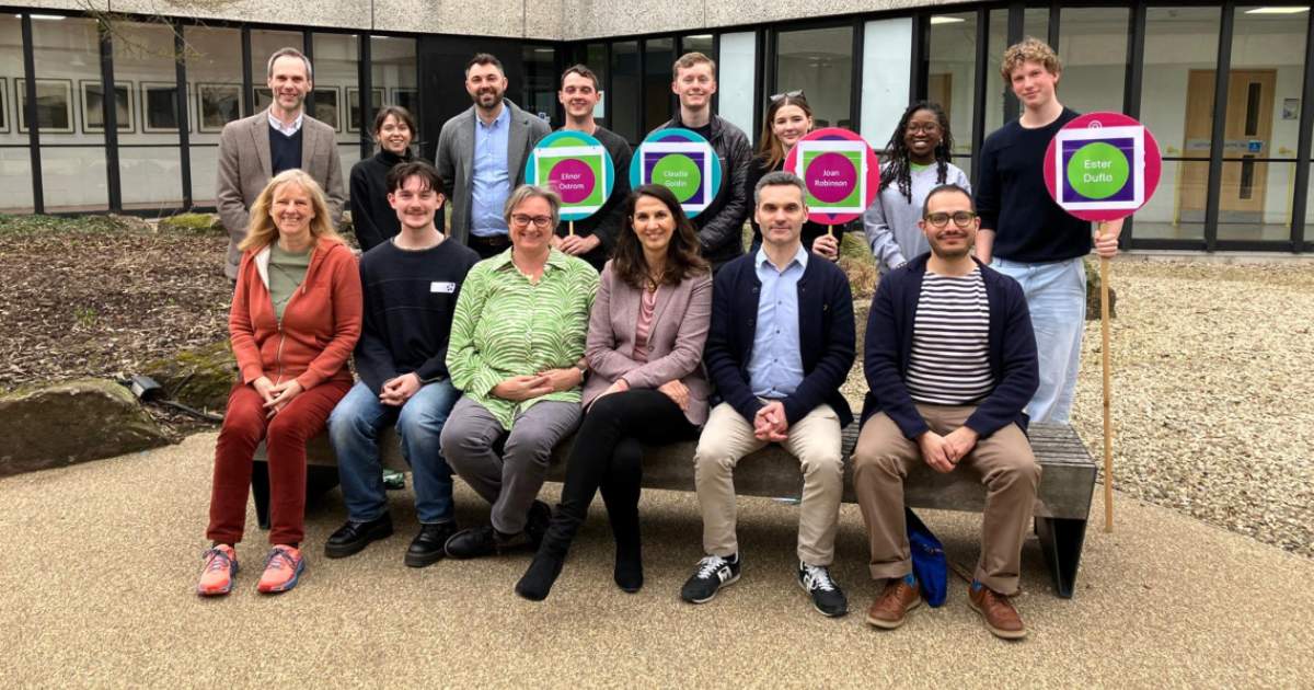group of men and women sitting and standing