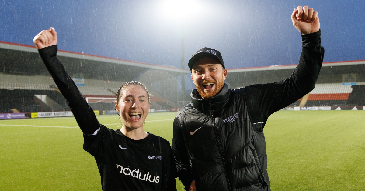 Goalscorer Kaitlyn Cook celebrates with Head Coach Nile Robbins.