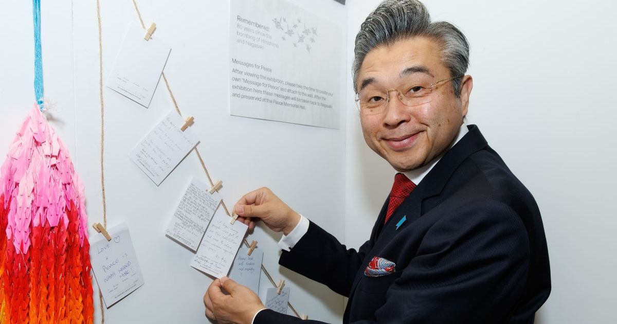 His Excellency Mr Hiroshi Suzuki, Japanese Ambassador to the United Kingdom signs a message of peace