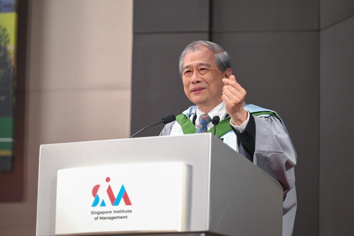 man at podium giving speech