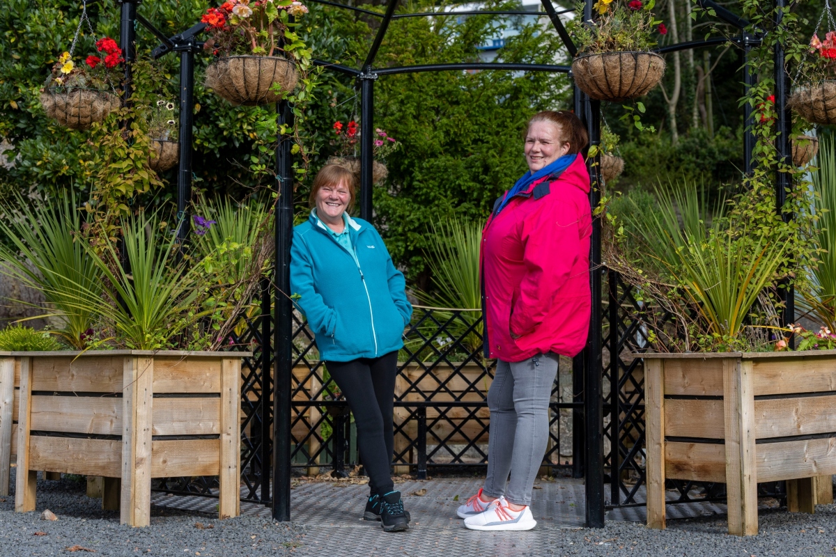two women standing outside