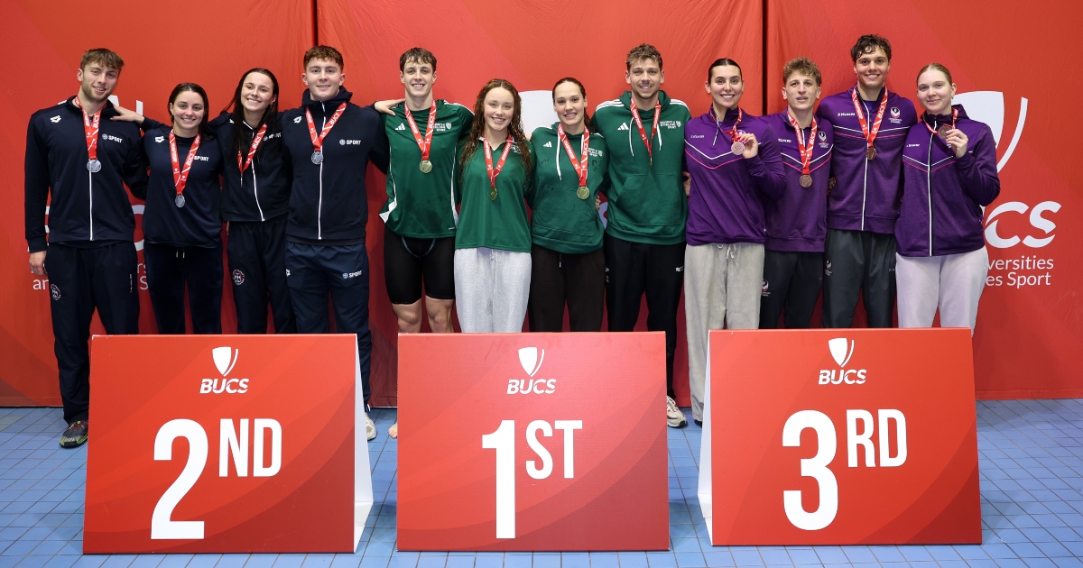 Stirling swimmers on podium after winning gold in the relay.
