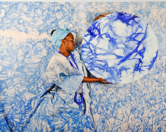 Person in blue and white holding a circle